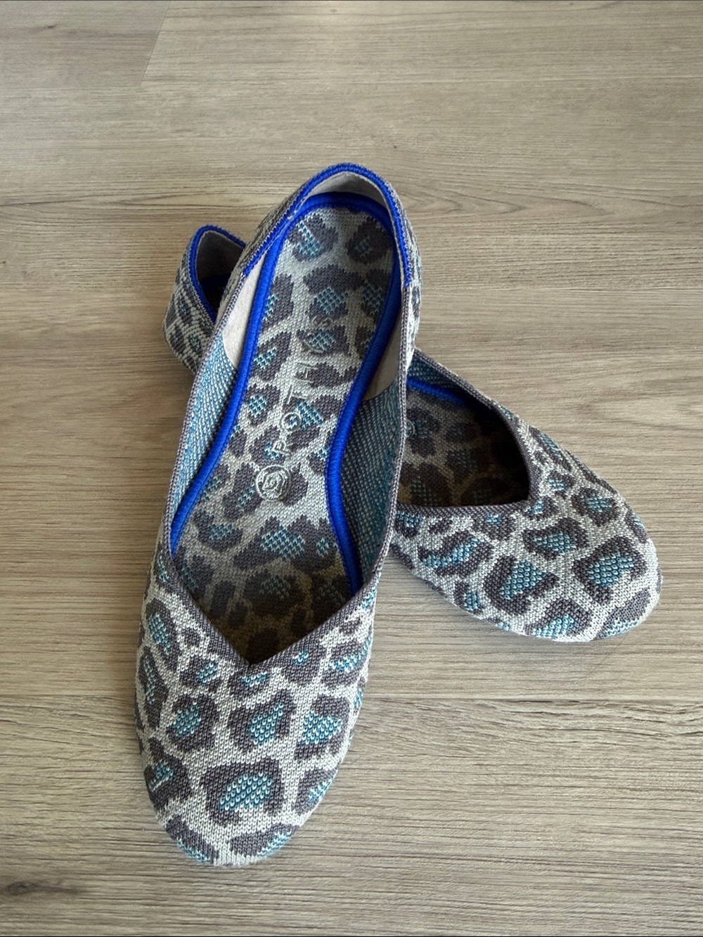 Rothy's Women’s Round Toe Flats - Animal Print with Blue Trim and Red Heel Tab